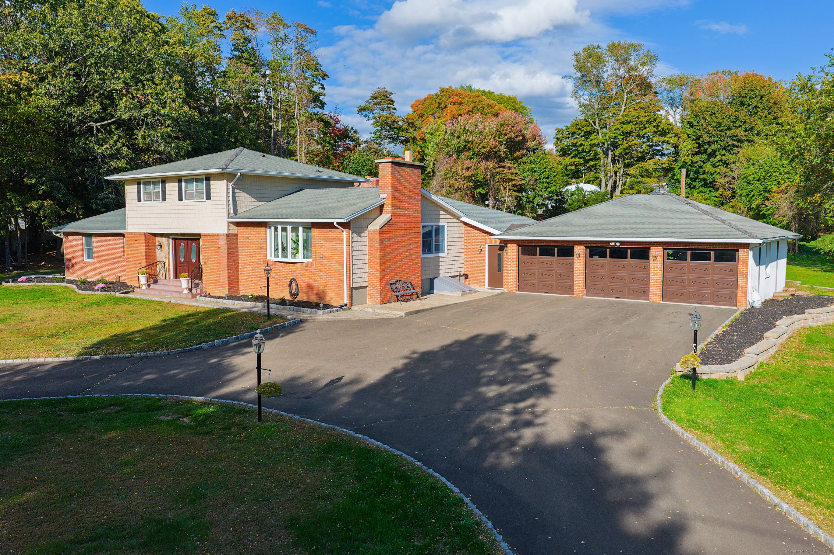Stunning Split Level Home with Expansive Living Spaces Dream Garage Setup.