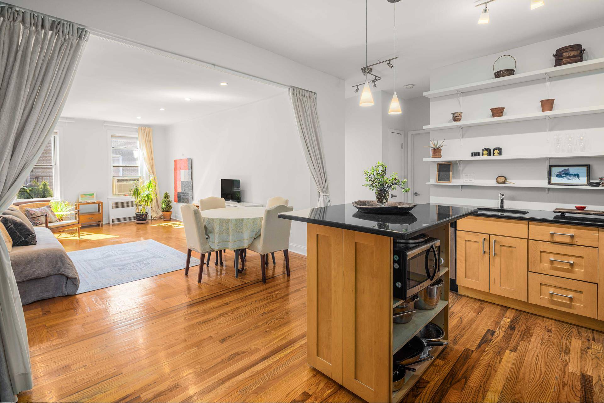 Spacious top floor, quiet, pre war apartment with a wide and open kitchen foyer living room.