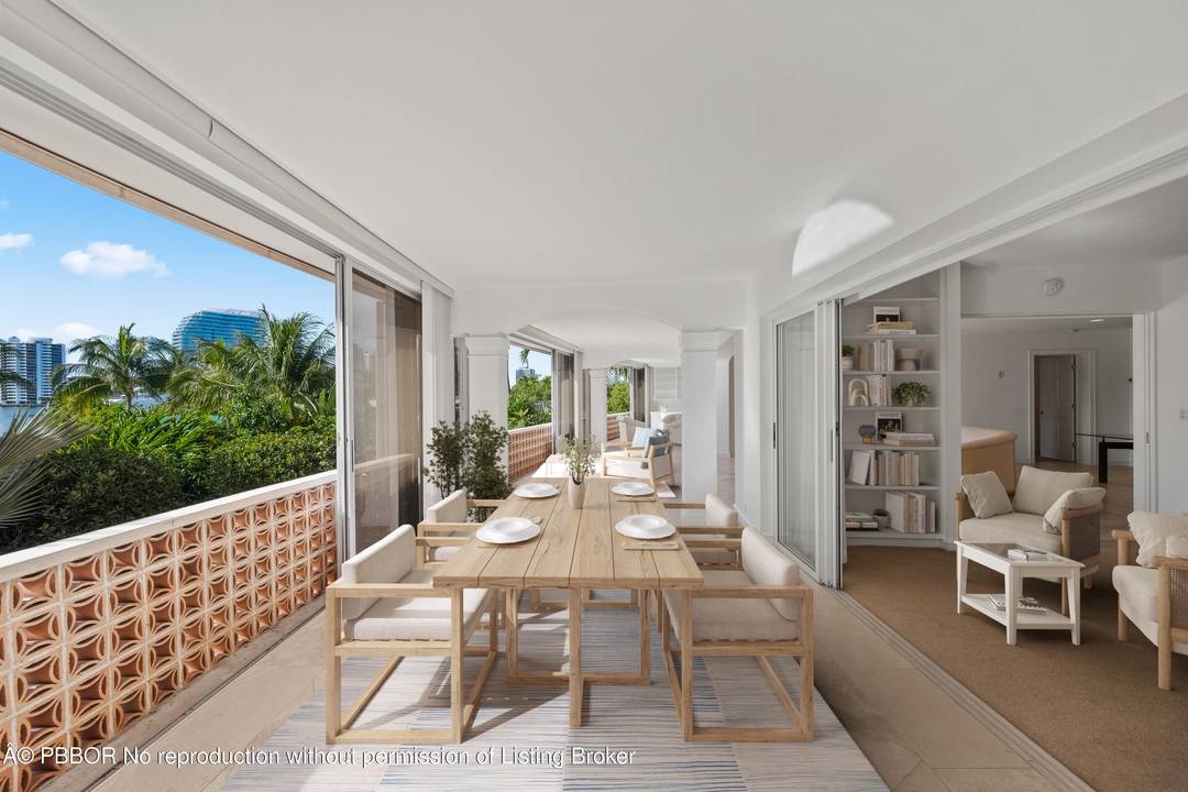 Spacious 2nd floor condo featuring two oversized bedrooms, two baths, and a bright sunroom that expands the open living area.