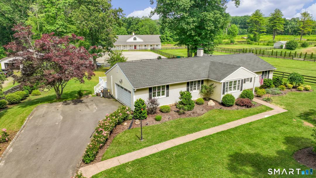 Discover this premier equestrian estate in sought after South Windsor offering 16 acres of pure bliss !