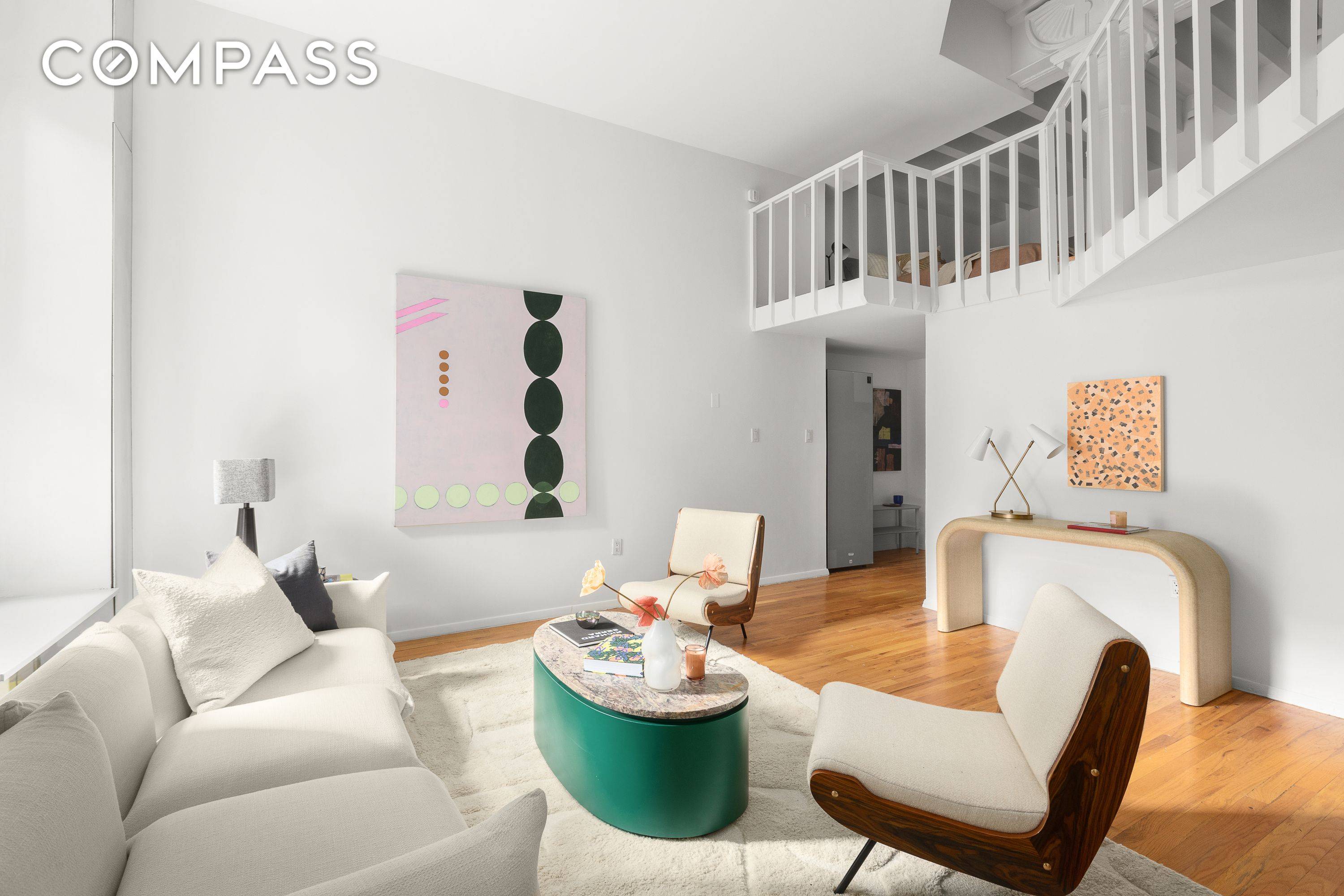 An expansive duplex loft offering one bedroom and one and a half bathrooms, with striking proportions, soaring ceilings, and a distinctive layout in a full service Greenwich Village building on ...