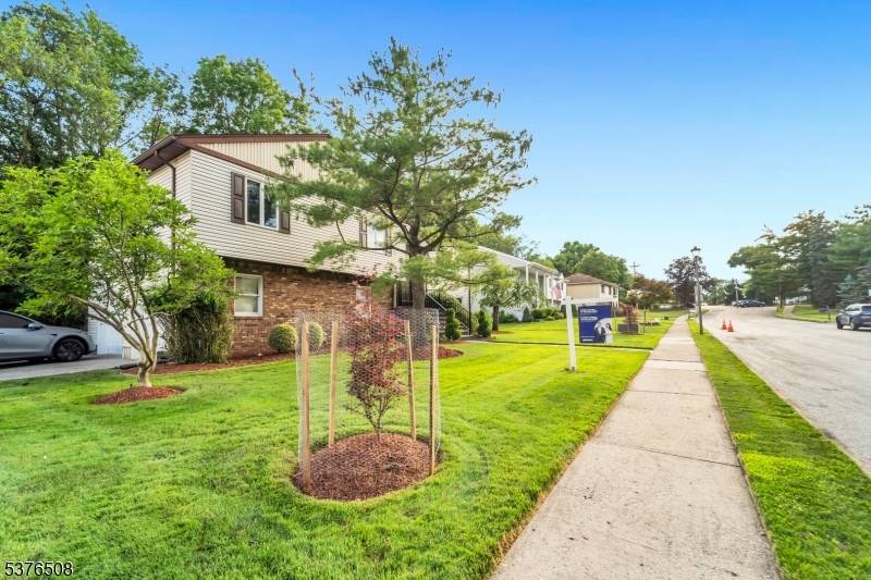 Welcome to this beautifully maintained bi level home with an inviting Entry Foyer, leading to a spacious upper floor with a bright Living Room, formal Dining Room, and a Modern ...
