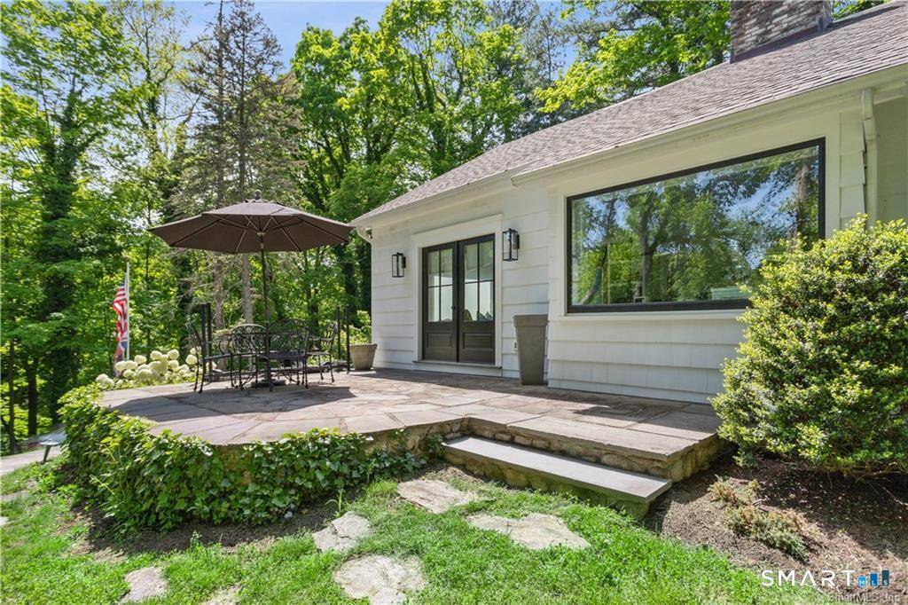 Welcome to 49 Newtown Avenue, a beautifully remastered 1910 Cape Tudor set on a private rear lot.