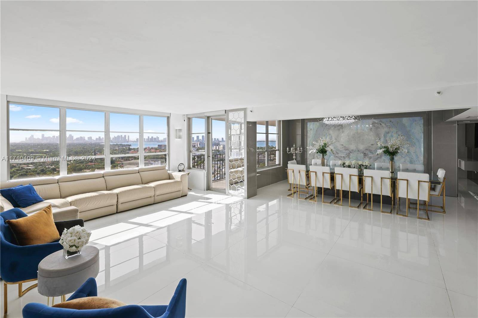 Elevate your lifestyle in this renovated, expansive residence on coveted Pine Tree Drive, where two units have been combined into one exceptional home.