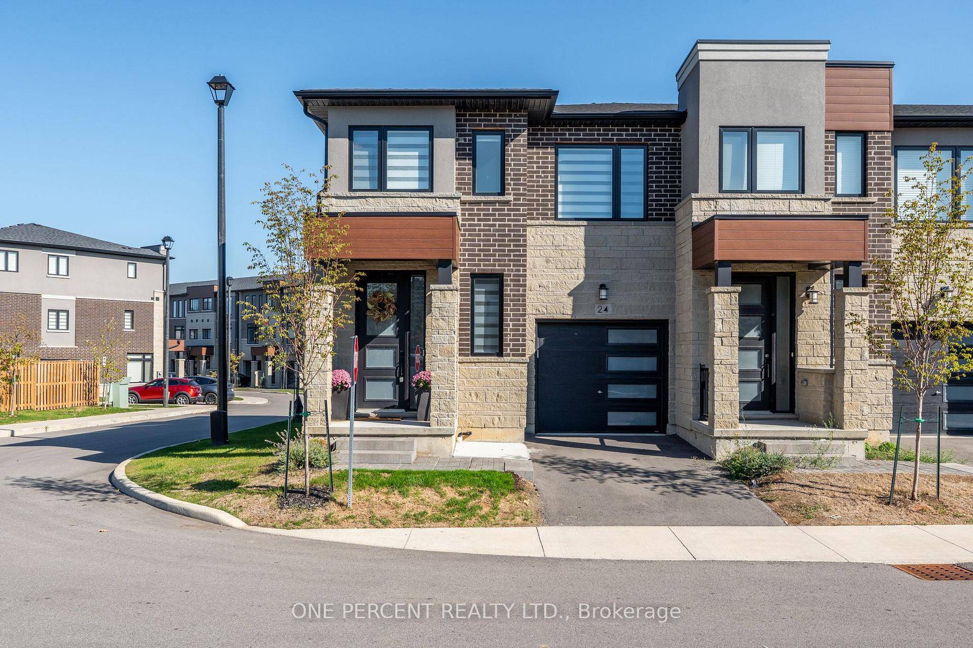Welcome to 24 Southam Lane, an elegant end unit townhouse on Hamilton's desirable West Mountain.