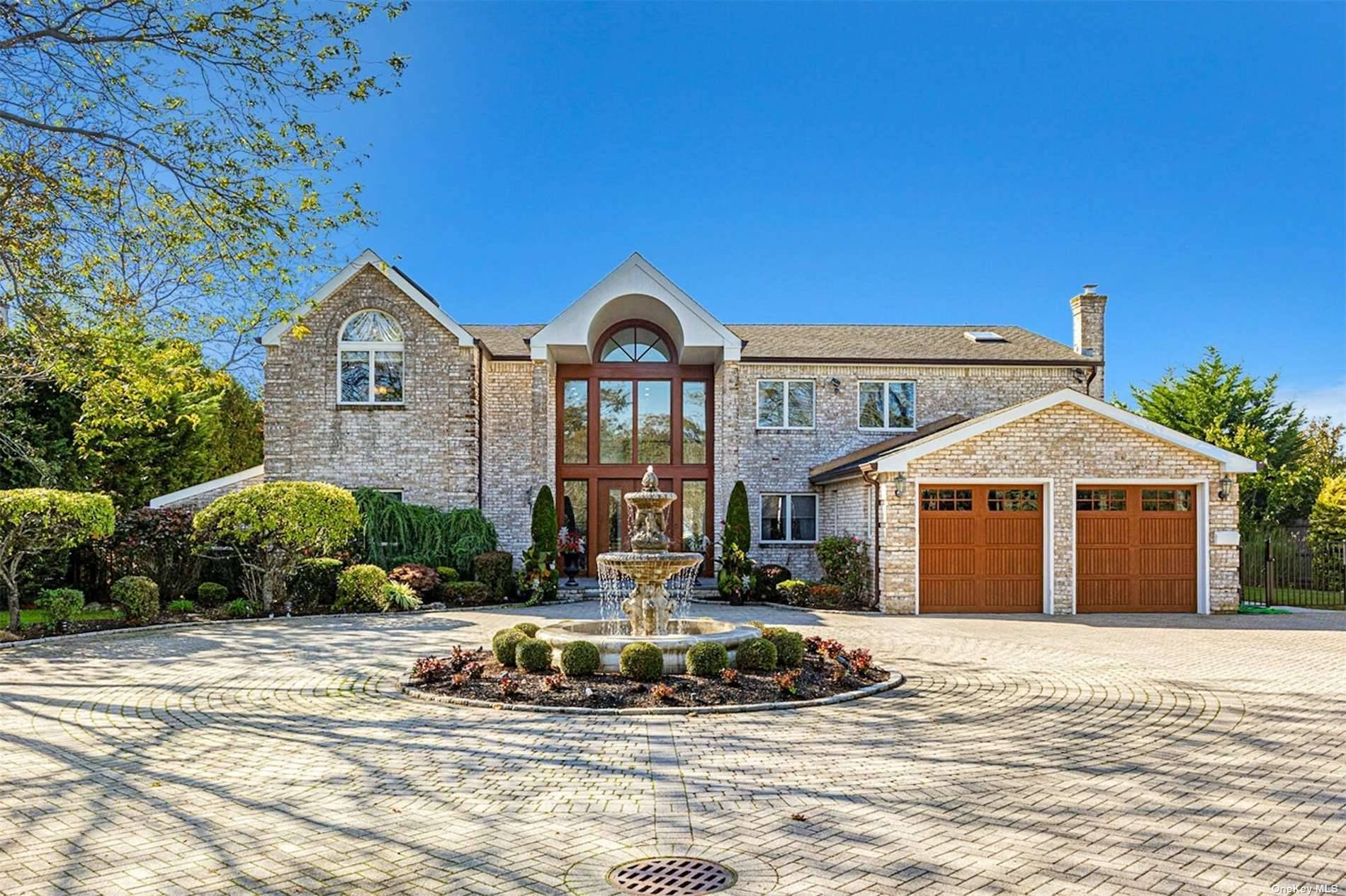 Privately gated, prestigious waterfront home in the heart of Bayberry Point Estates.