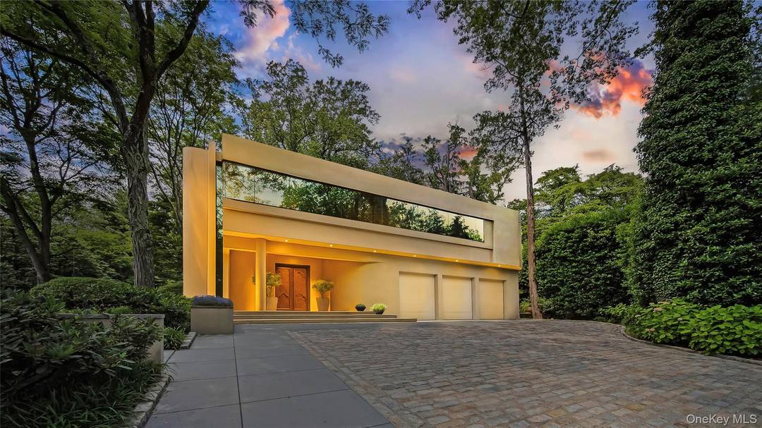 Welcome to a sanctuary in North Hills a one of a kind Frank Lloyd Wright inspired contemporary masterpiece, creating a living space that feels both timeless and inviting.