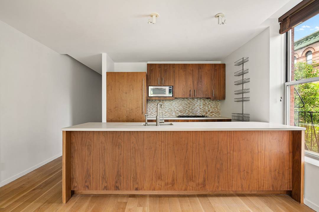 Welcome to Apartment 3B at One Strivers' Row a 1, 244 square foot two bedroom, two bathroom condominium in Central Harlem.