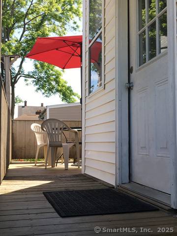 223 Broad Street in Meriden, CT, is an investment opportunity featuring 9 units rooms, three shared kitchens, and three bathrooms.