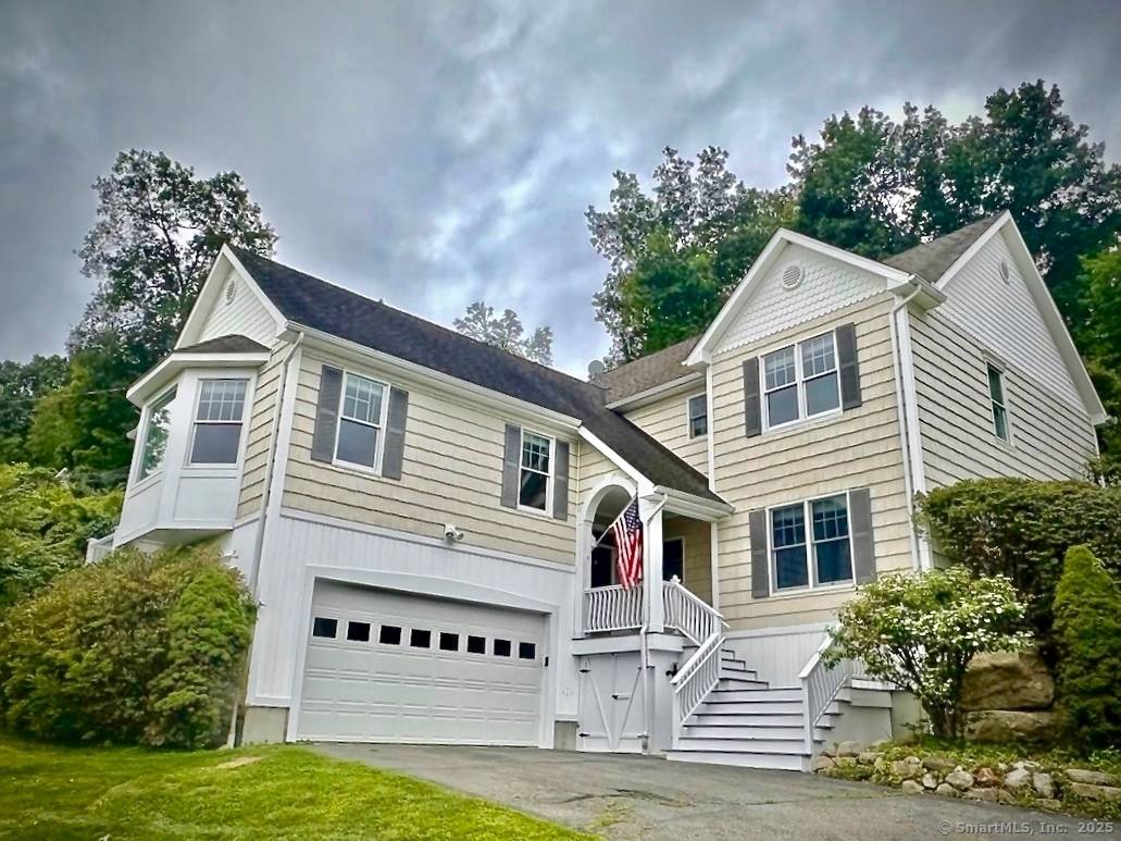 Located in lower litchfield county, through rolling hills, horse farms and pastures, and set a short stroll away from a sandy beach and boat dock on Candlewood lake, this updated ...