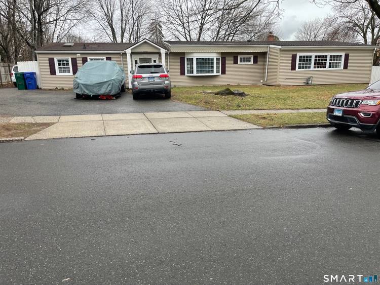 Beautifully renovated ranch on a quiet street, offering a spacious main living area boasting a kitchen with stunning custom cabinets, granite countertops, and a large center island with stainless steel ...