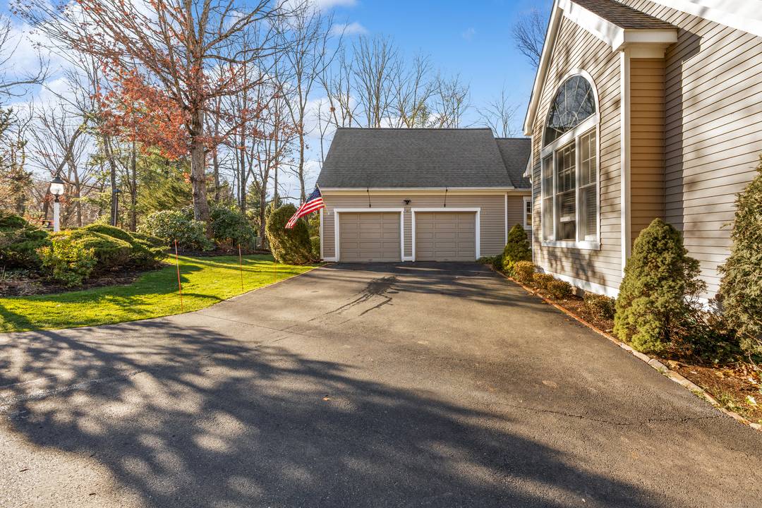 Welcome home to this beautifully maintained cape style condo tucked within a quiet Cheshire community near the town center.