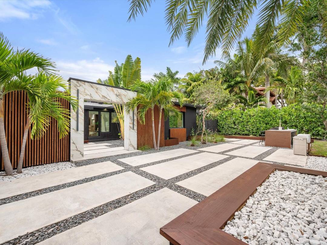 LUXURY updated 4 bedroom 3 bathroom SMART home in Coral Ridge, offering complete PRIVACY behind a steel gate on a 10, 000 SF lot, minutes from the beach, dining, and ...