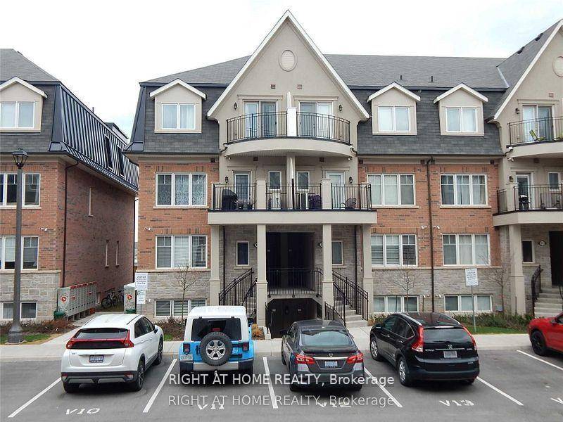 Unit 29 04 Discover the epitome of modern living in this stunningly upgraded stacked townhome, perfect for families working from home or those seeking an easy commute via QEW.