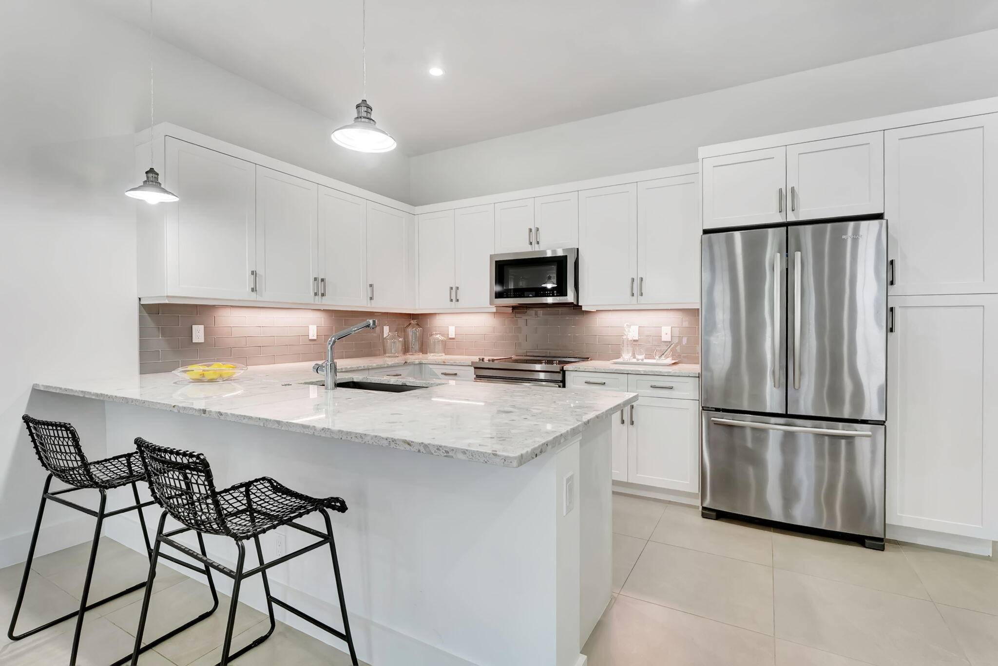Welcome to this rarely available coastal contemporary townhome located in the most sought after spot within the charming St.