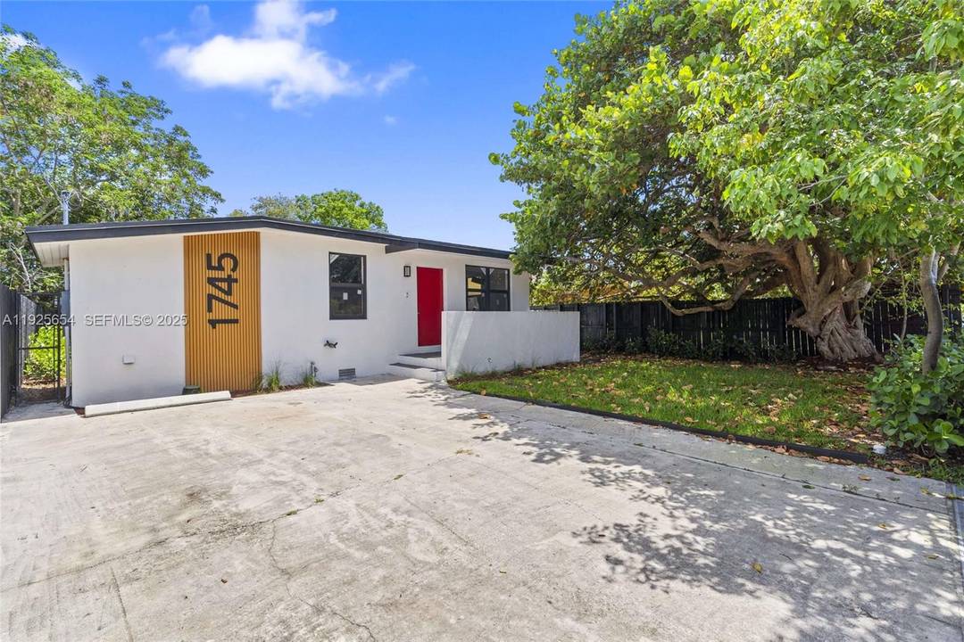 Beautiful 2 bedroom, 2 bath single family home in Opa locka featuring an oversized backyard with endless potential for outdoor living and entertaining.