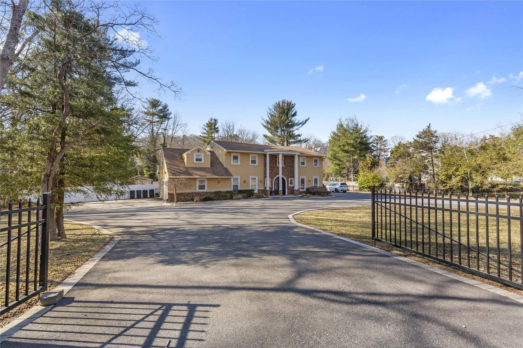 Welcome to this gated and updated 5000 sqft center hall colonial !