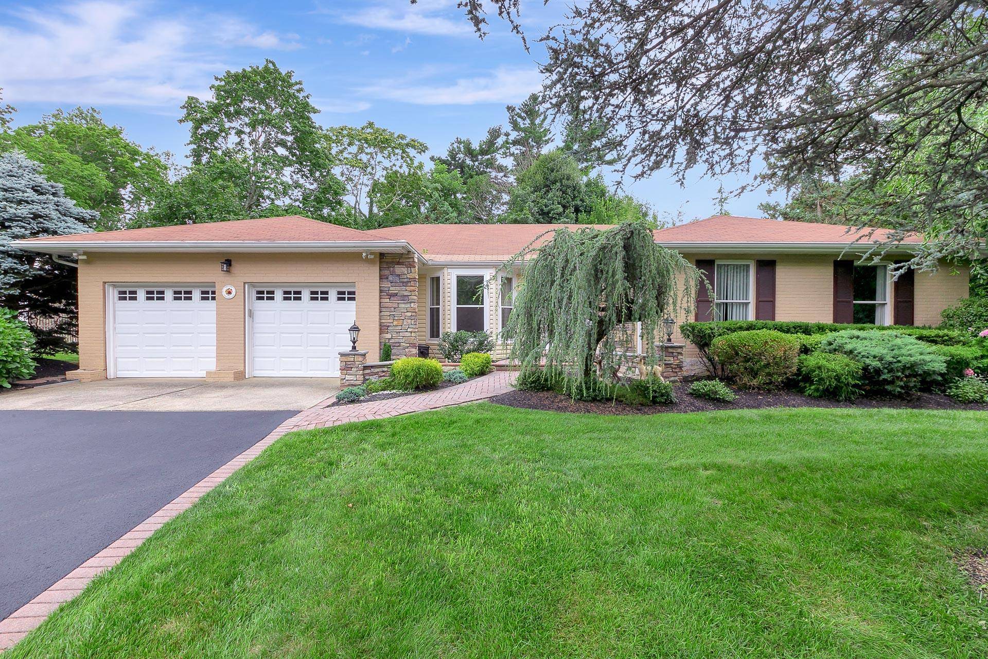 Beautifully maintained and spacious ranch home nestled on a level half acre lot in a quiet cul de sac.