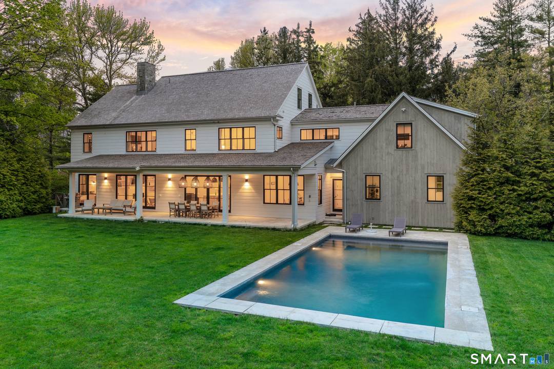 Introducing 13 Sunswyck Rd, a distinguished custom residence set within Darien's prestigious Delafield Island.