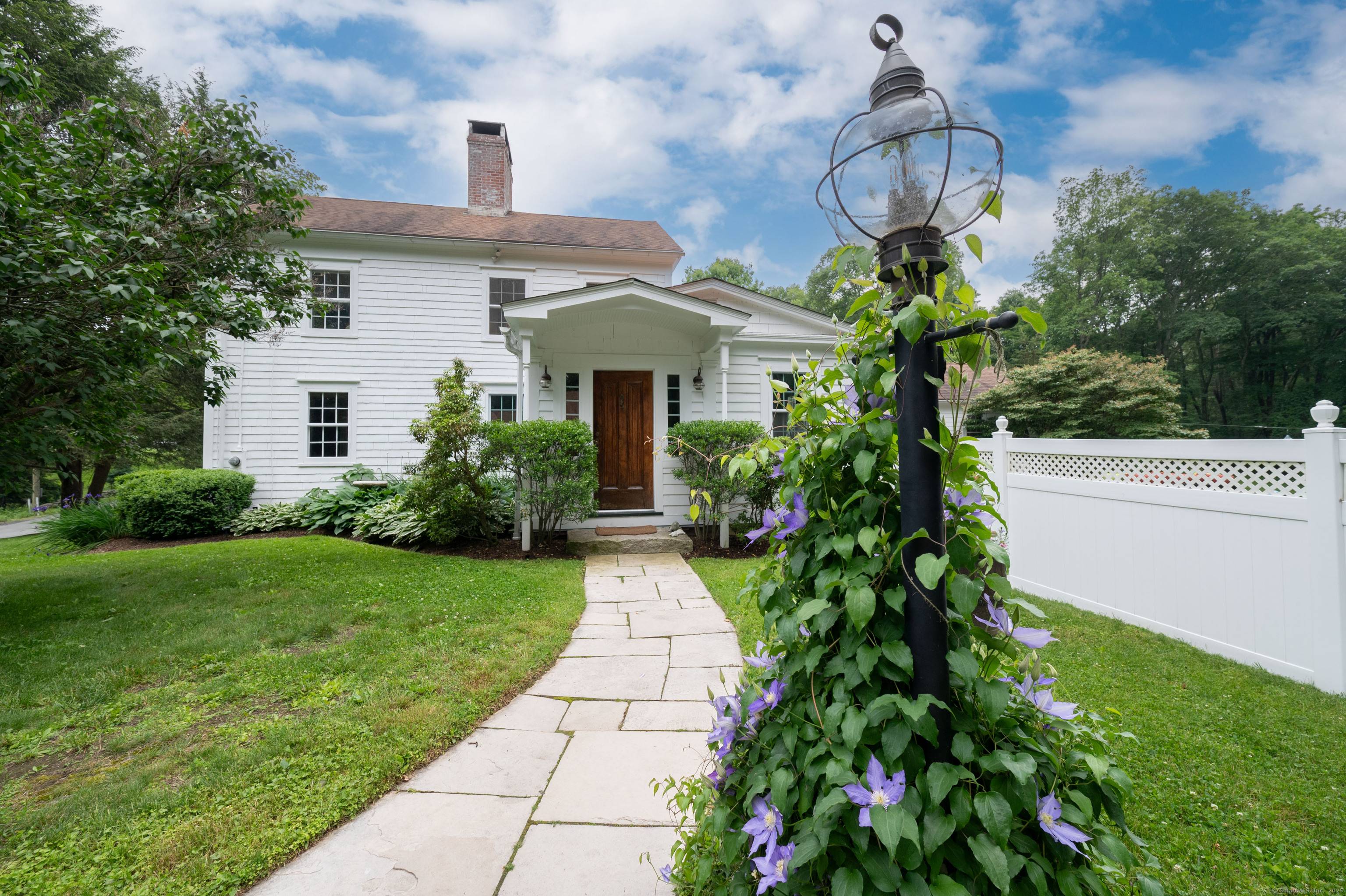 This charming 1870 antique home is pure perfection conveniently located in West Redding.