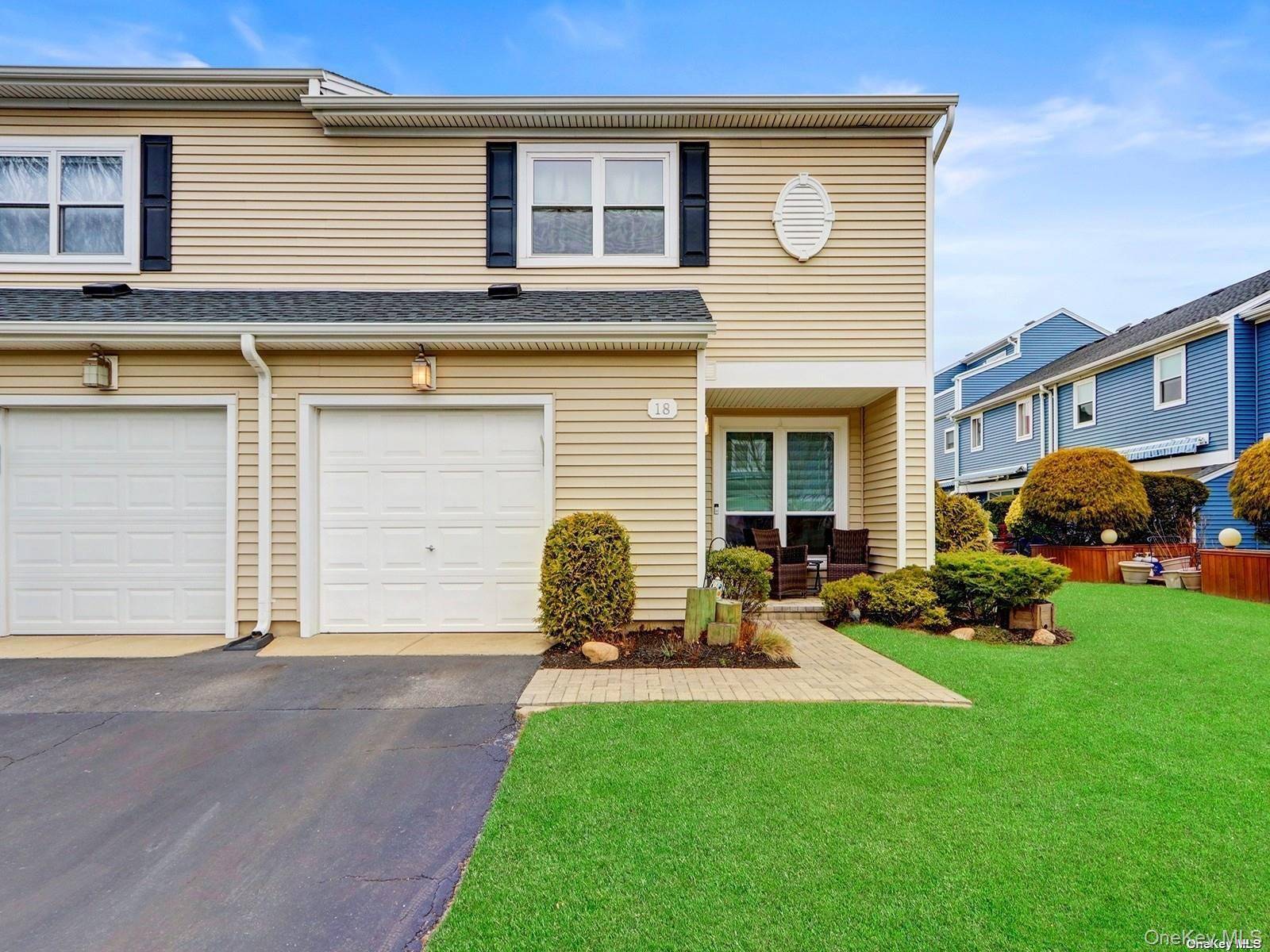 Pristine corner unit in a waterfront gated community.