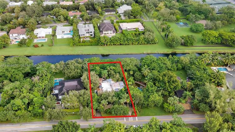 Prime redevelopment opportunity on an oversized 12, 000 SF lot with a picturesque canal backdrop and mature trees providing privacy and a beautiful natural setting.