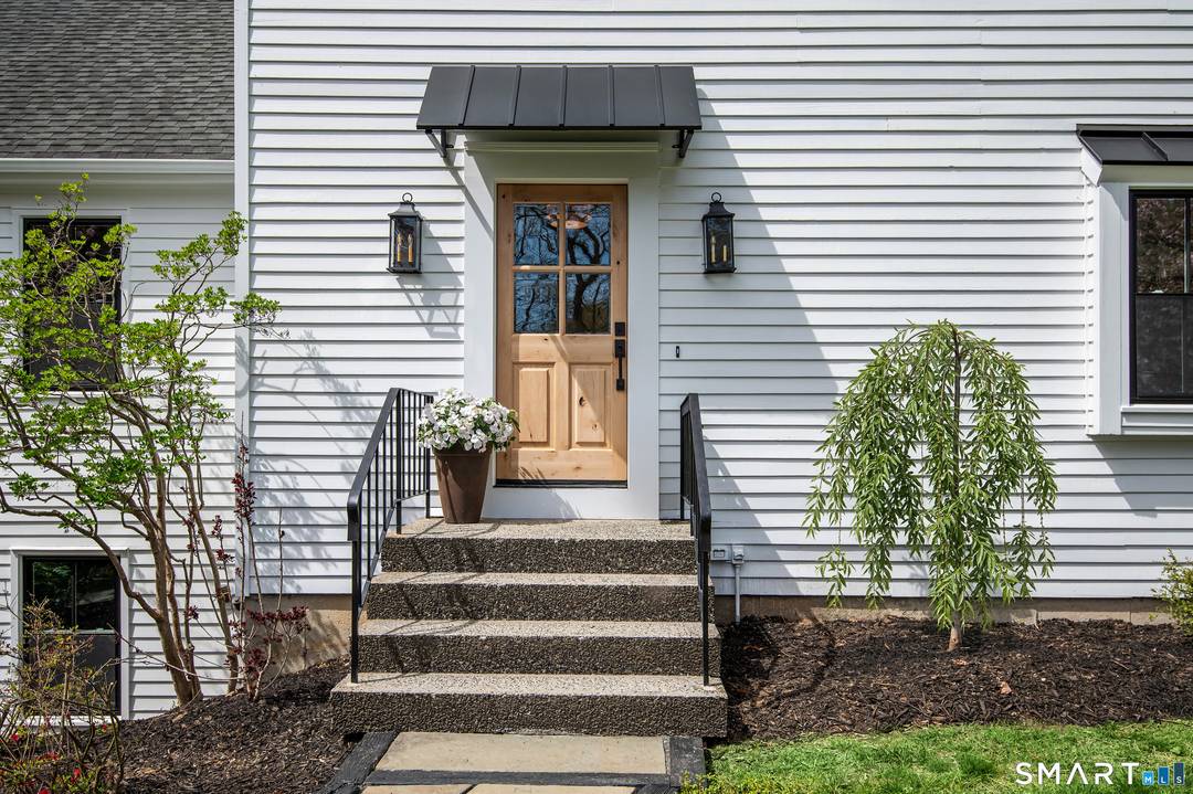 Classic Colonial reimagined w a modern French sensibility, set on a beautifully landscaped acre in South Ridgefield near the Wilton border.