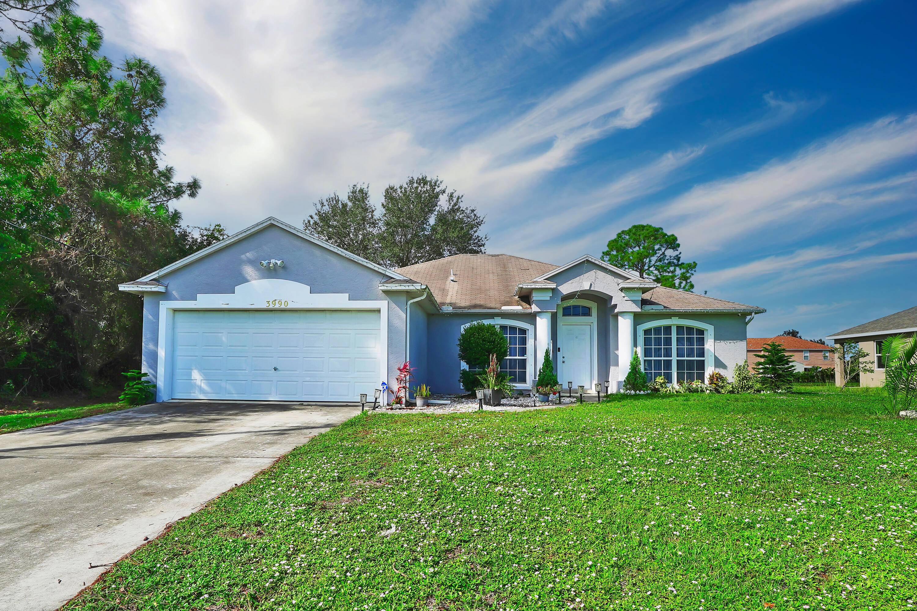 Step into this stunningly remodeled 4 bedroom, 2 bathroom home with a 2 car garage, NO HOA nestled in one of Port St.