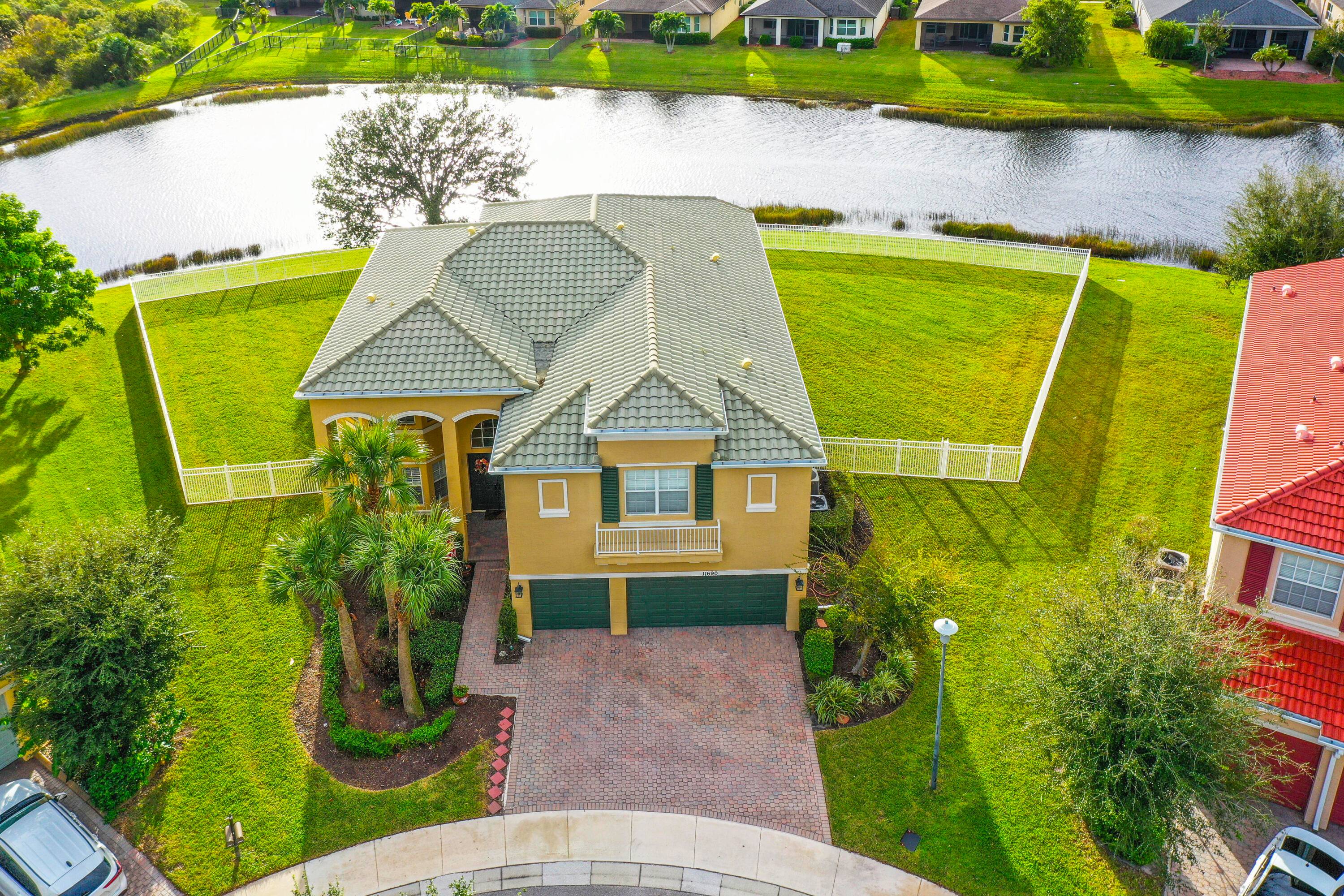 Step into elegance and space with this magnificent 5 bedroom, 4 bath, 3 car garage lakefront estate, perfectly situated on an oversized cul de sac lot in TownPark community.
