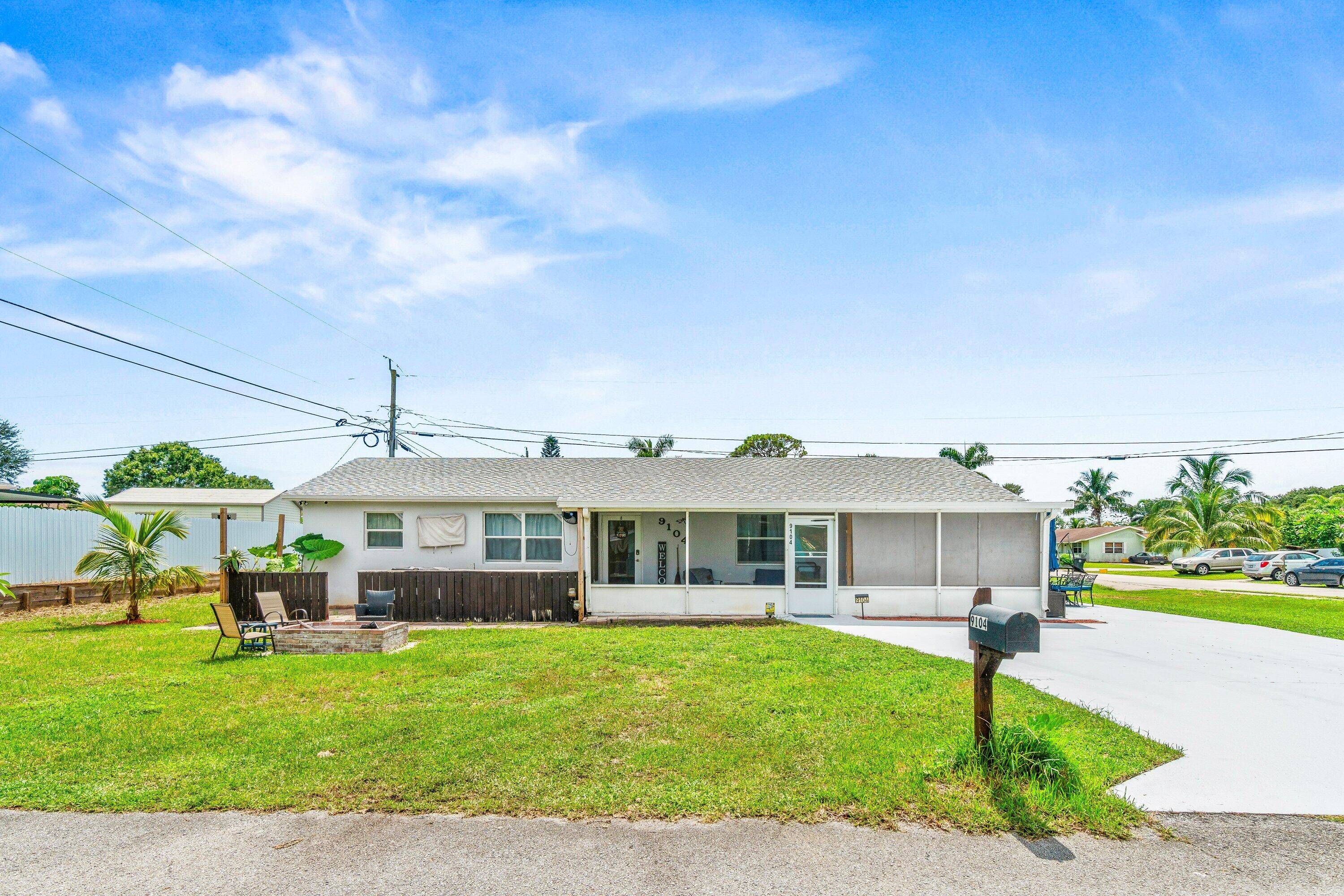 Rare 4 bedroom, 2 bath CBS home in desirable West Lake Worth location !