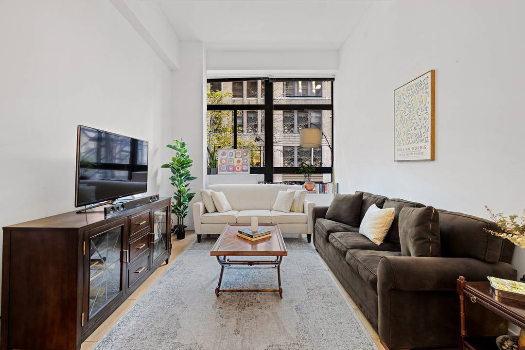 This quality, over 700 square foot turn key studio flex 1 bedroom boasts 12 foot ceilings, oversized south facing windows, and an exceptional seven massive closets with hardwood doors.