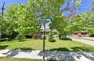 This charming bungalow sits on a picturesque tree lined street on a rare 82.