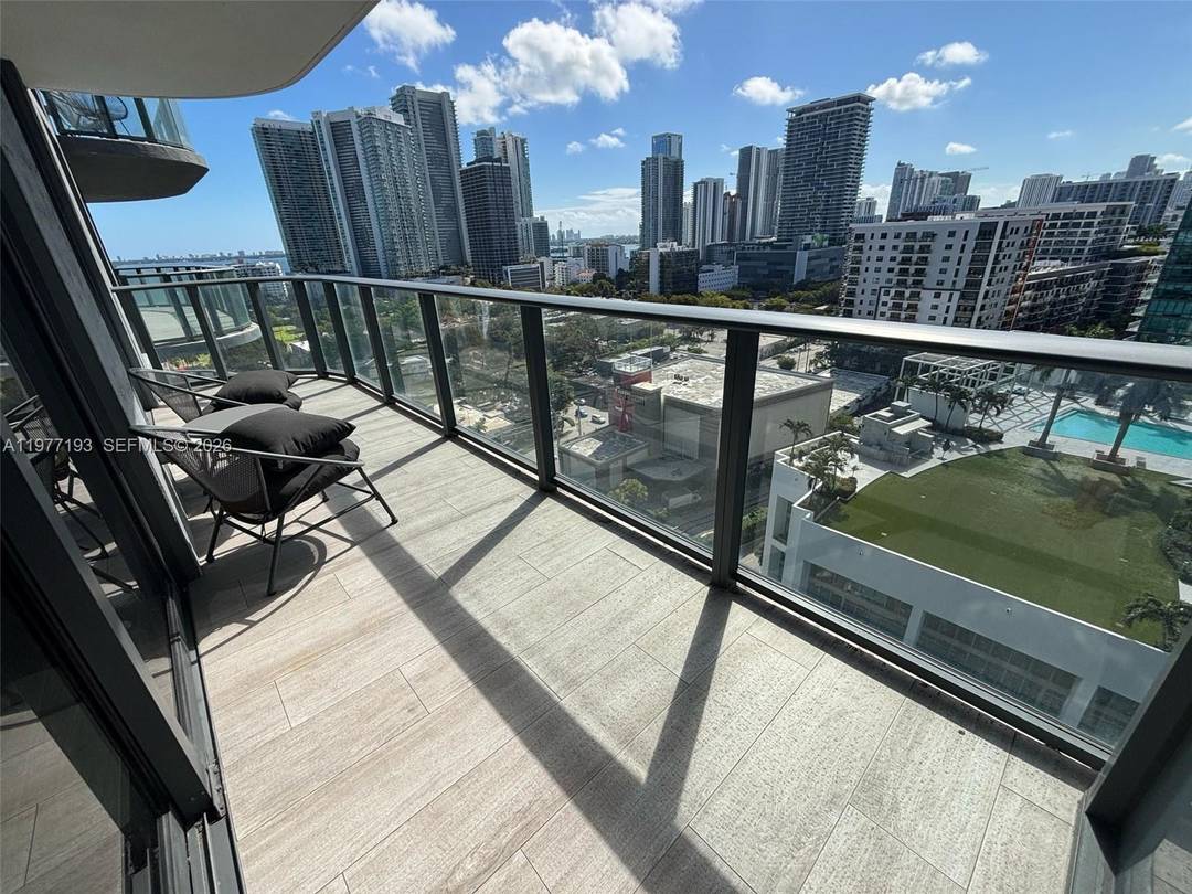 Luxurious 1 Bed 1 Bath Den apartment at Hyde Suites Residences, offering stunning water and skyline views.