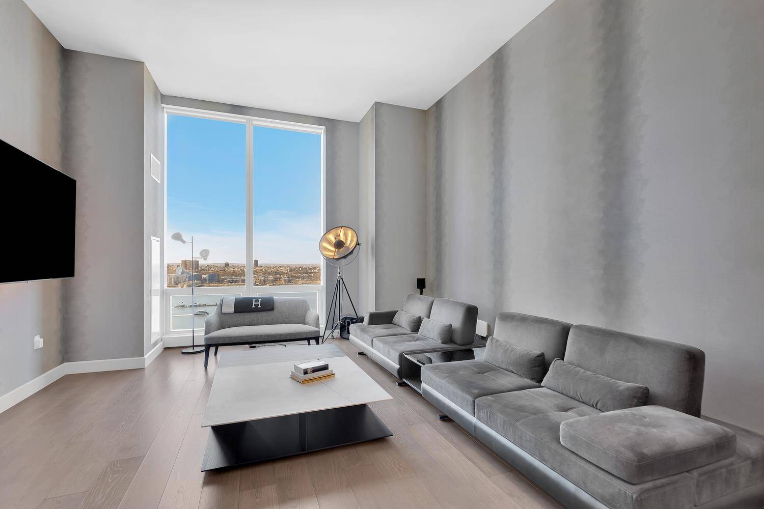 This is an exceptional, two bedroom home with high ceilings ; and sunset views of the Hudson River.
