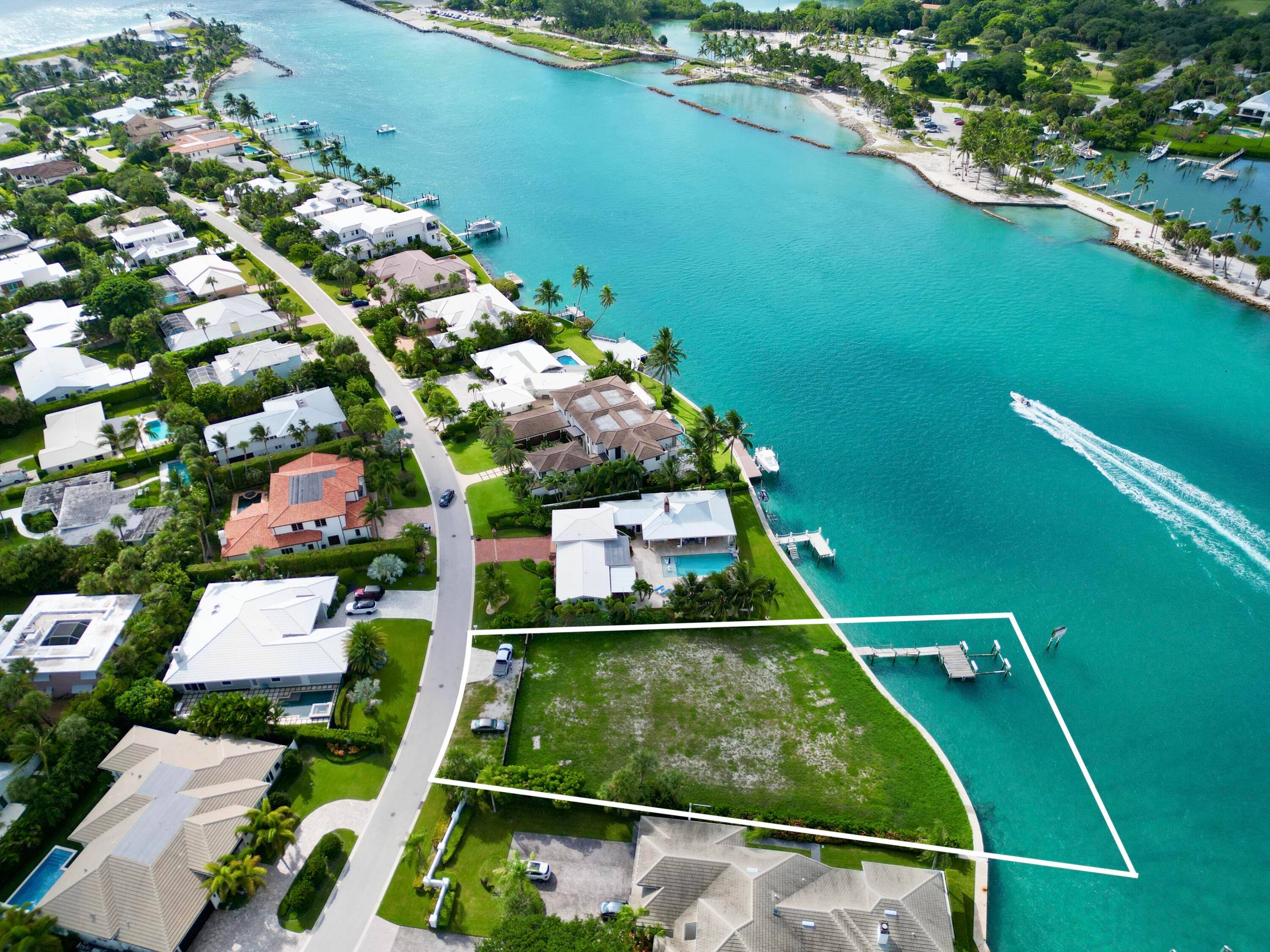 Exclusive Waterfront 1 2 Acre Lot in Jupiter Inlet Colony Direct Inlet Frontage with Lighthouse Views.