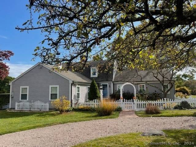 Park like grounds surround this classic Gambrel located on a quiet side street in the sought after Montauk Avenue area of Stonington.
