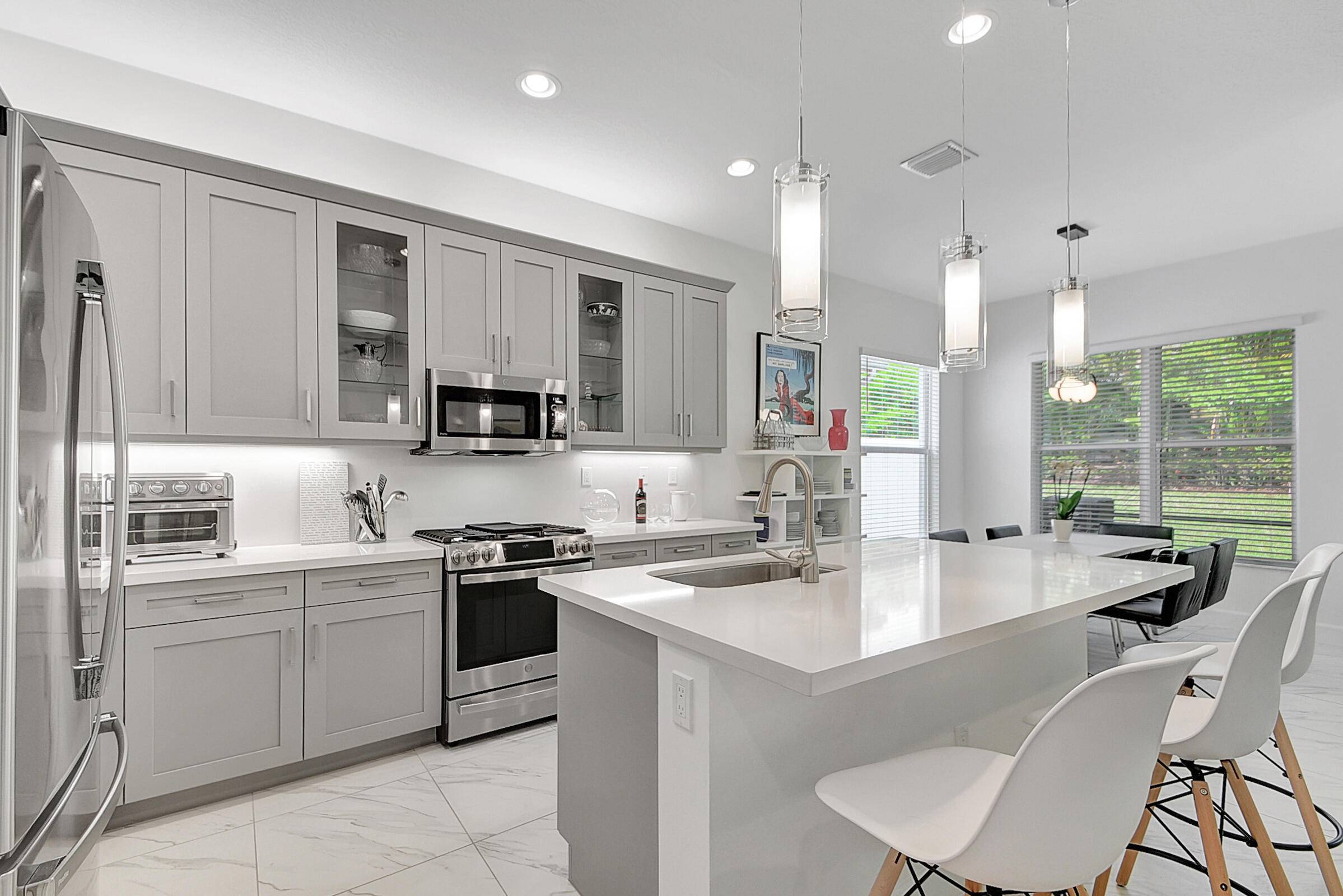 Welcome to your nearly new dream home in Valencia Sound, the latest gem in GL Homes Boynton Beach's coveted real estate landscape.
