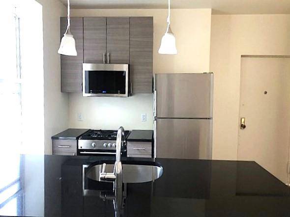 Bright newly renovated 2BR apartment with windowed Eat in Kitchen, center island with granite counter tops, new cabinets and stainless steel appliances.
