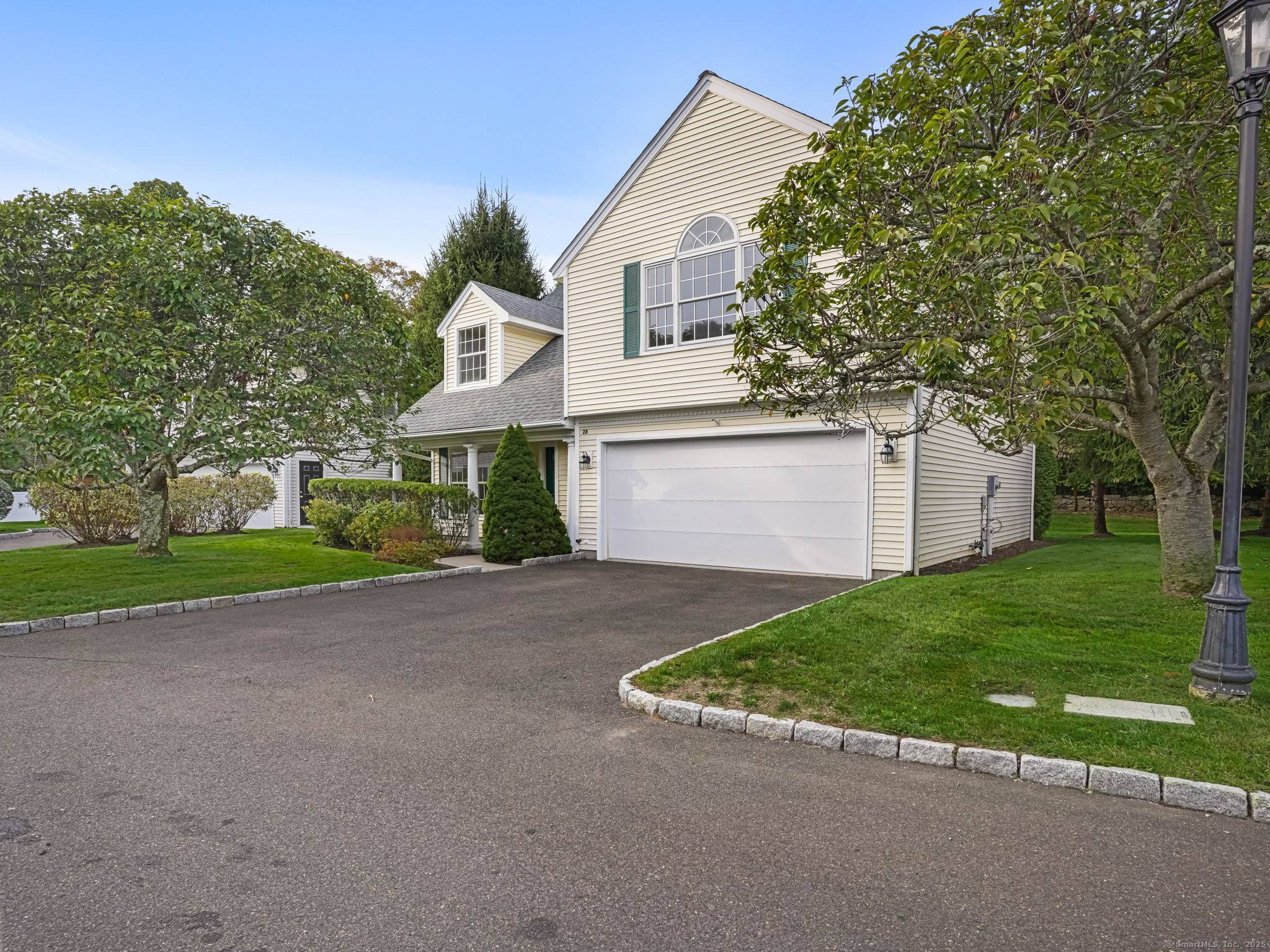 New to the market in South Wilton you'll love this easy maintenance, free standing home in the beautiful community of Grumman Hill Village !