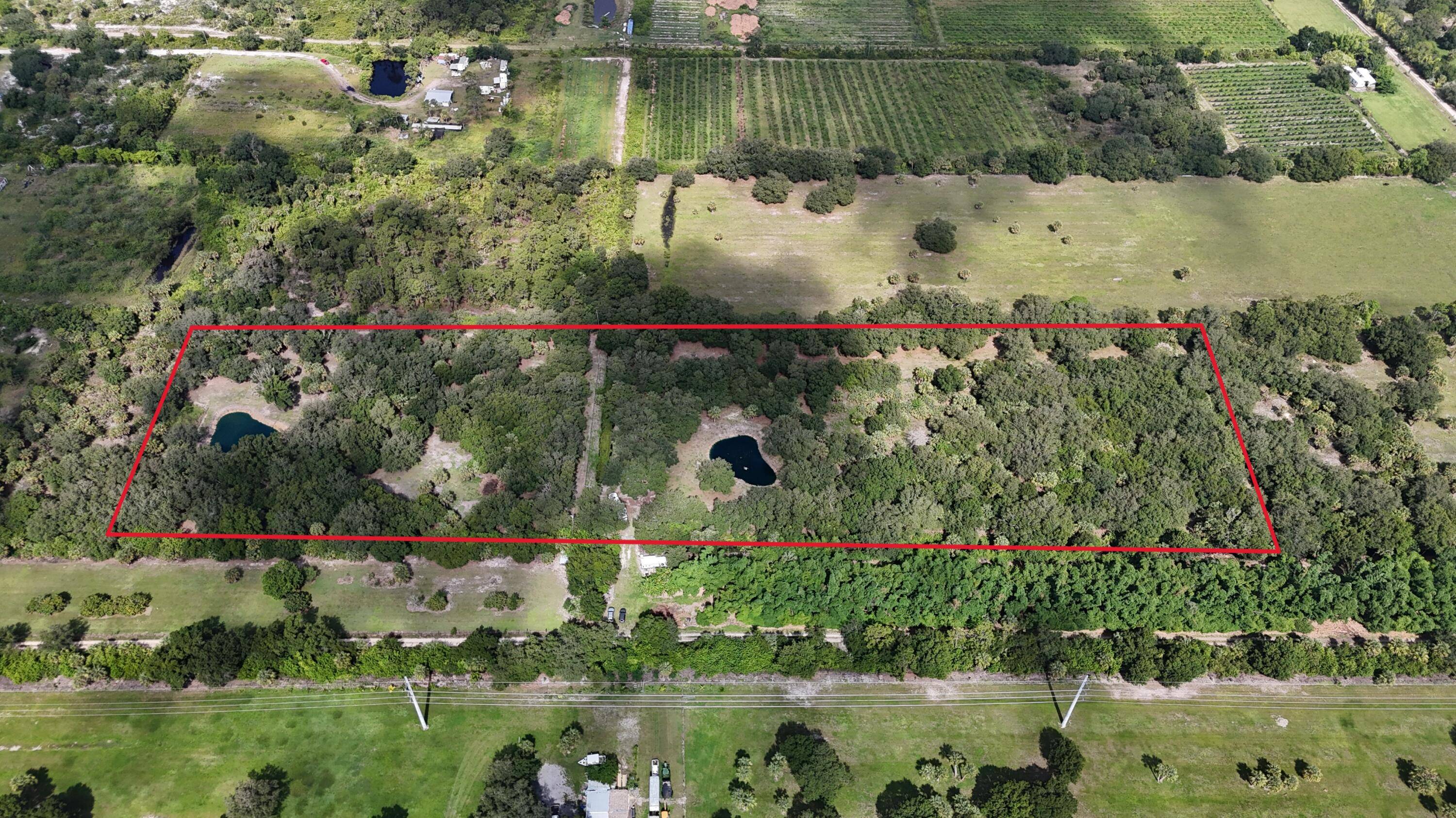 This exceptional property boasts over 10 fully fenced, high, and dry acres in Martin County, meticulously maintained and improved to perfection.
