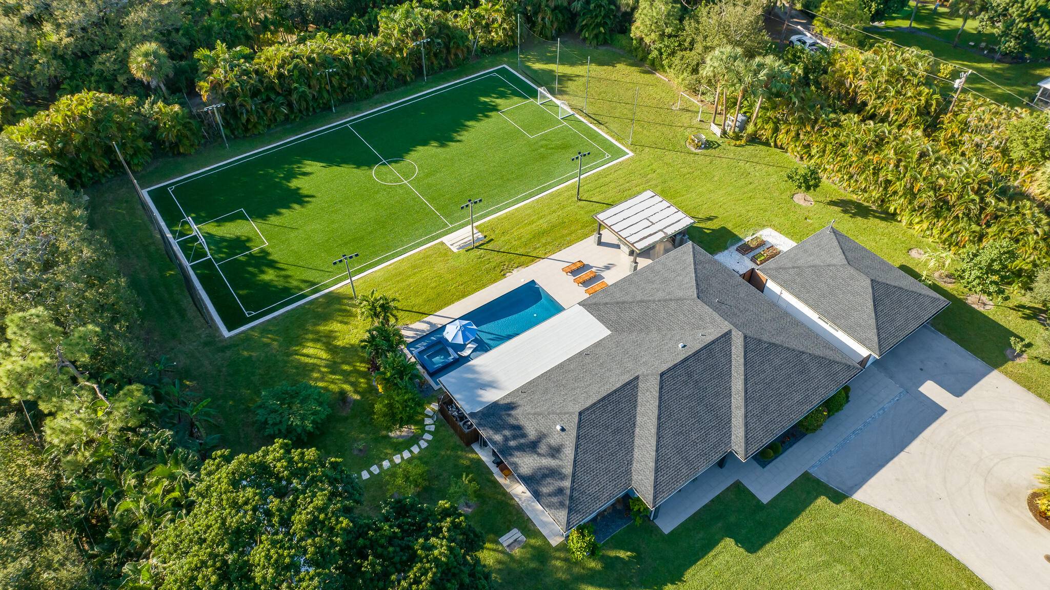 Spanning almost 1. 6 acres is this beautifully landscaped and private residence !