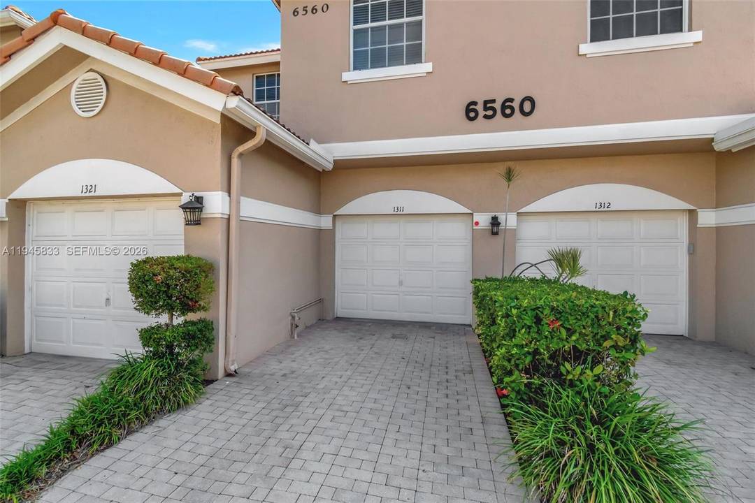 Sparkling clean, tastefully updated first floor villa with incredible closet space, garage, enclosed patio and all the bells and whistles.