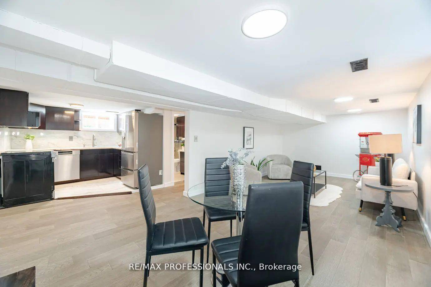 Bright lower level, with above grade windows, offers a luxurious kitchen, spacious livingroom diningroom and 2 bedrooms.