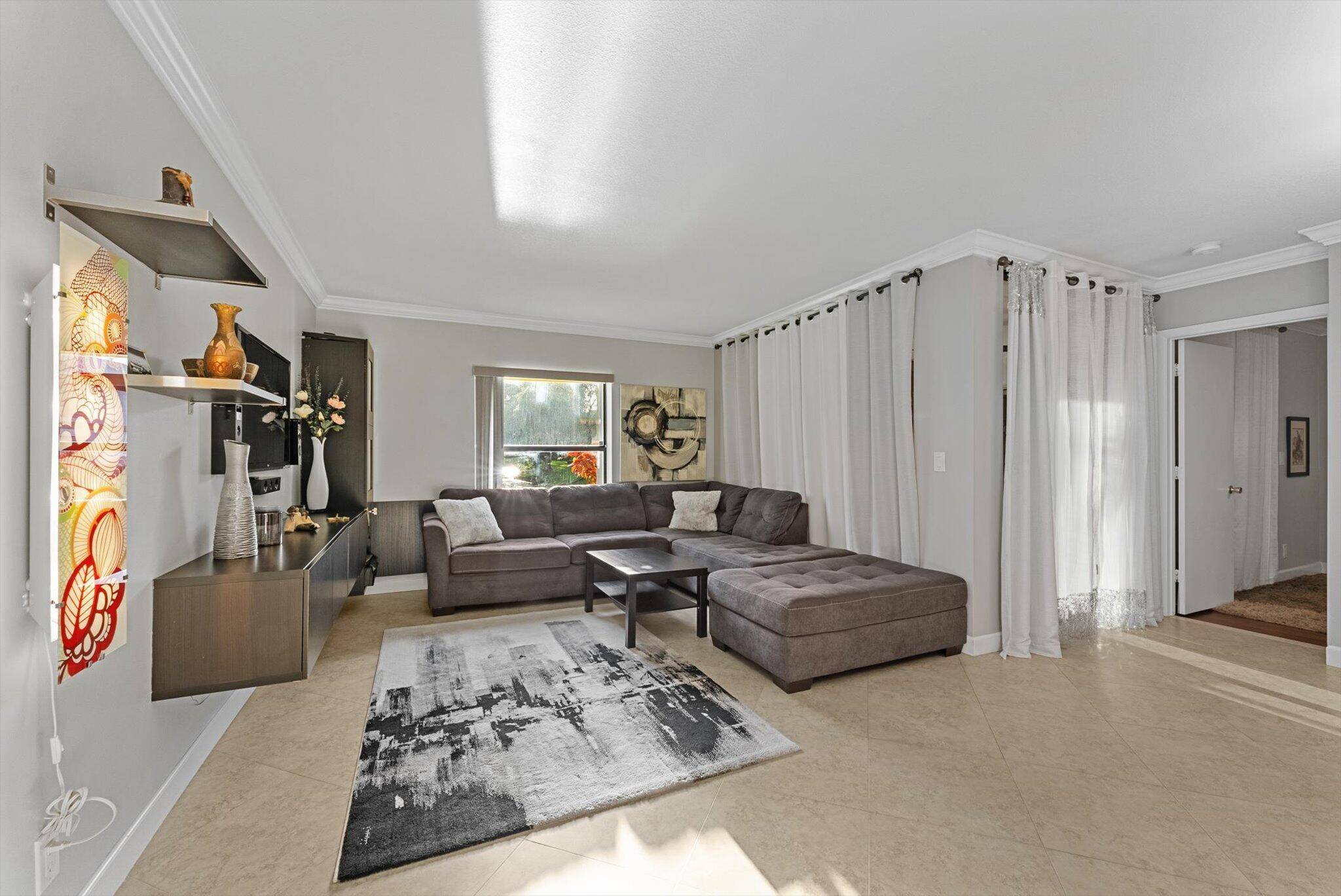 Welcome home to this beautifully updated first floor condo, ideally located in the highly sought after Applewood IV community within The Township of Coconut Creek !