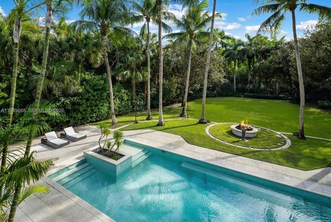 Discover this stunning, modernized Mediterranean estate on nearly an acre in the coveted Ponce Davis neighborhood !