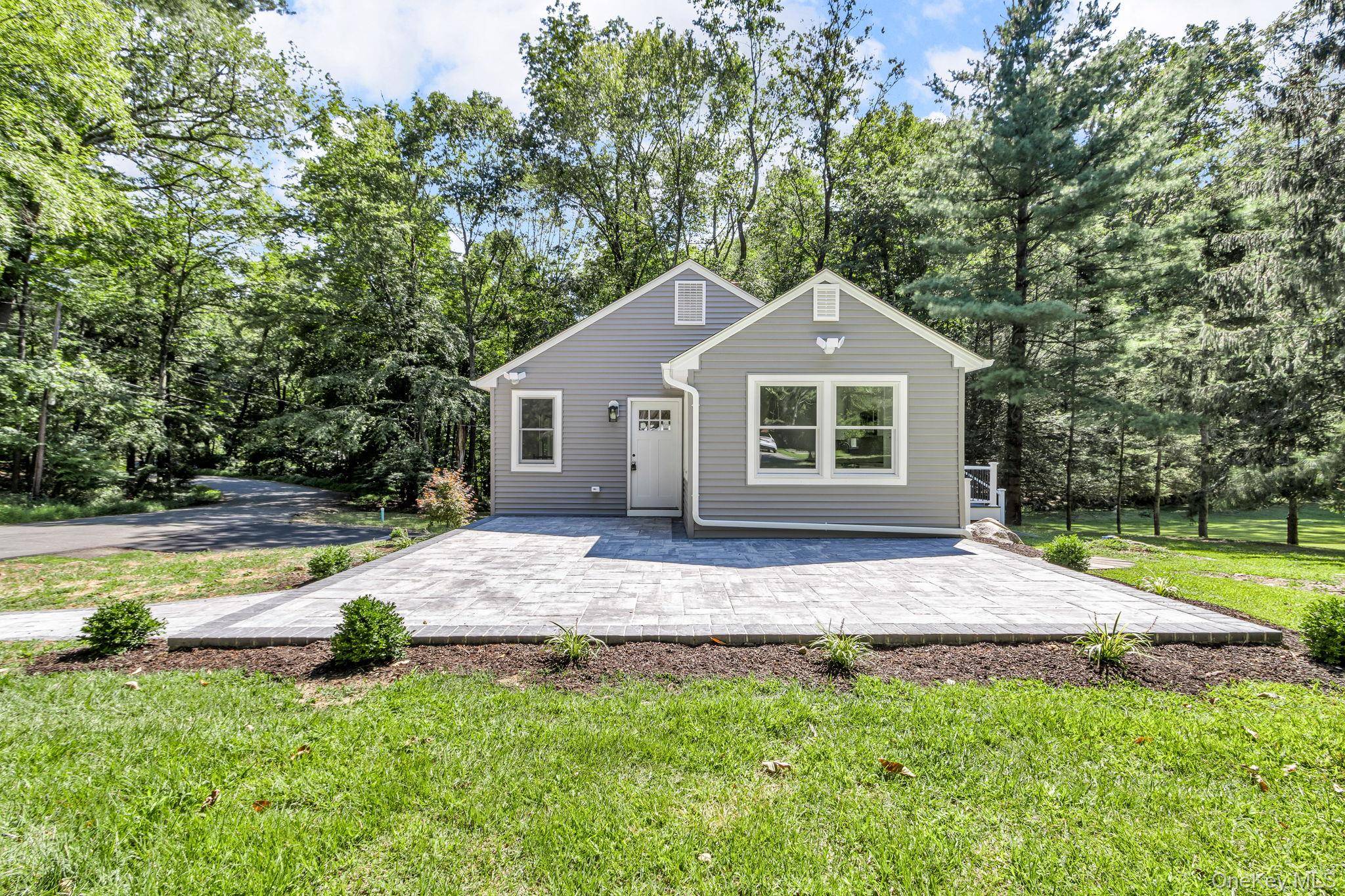 Welcome Home to Mohegan Lake This stunningly renovated home has been completely transformed from its ranch style roots into a modern, move in ready retreat.