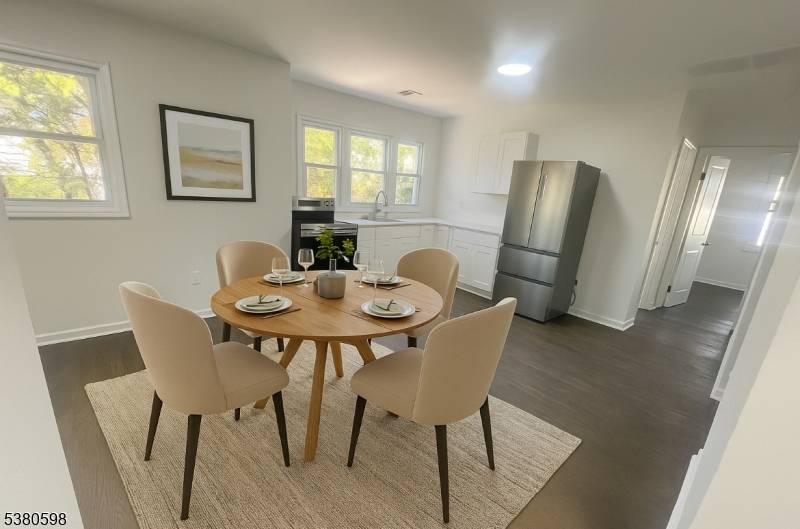 This beautifully renovated second floor multifamily property features four bedrooms, including a master bedroom with its own master bathroom, plus another full bathroom.