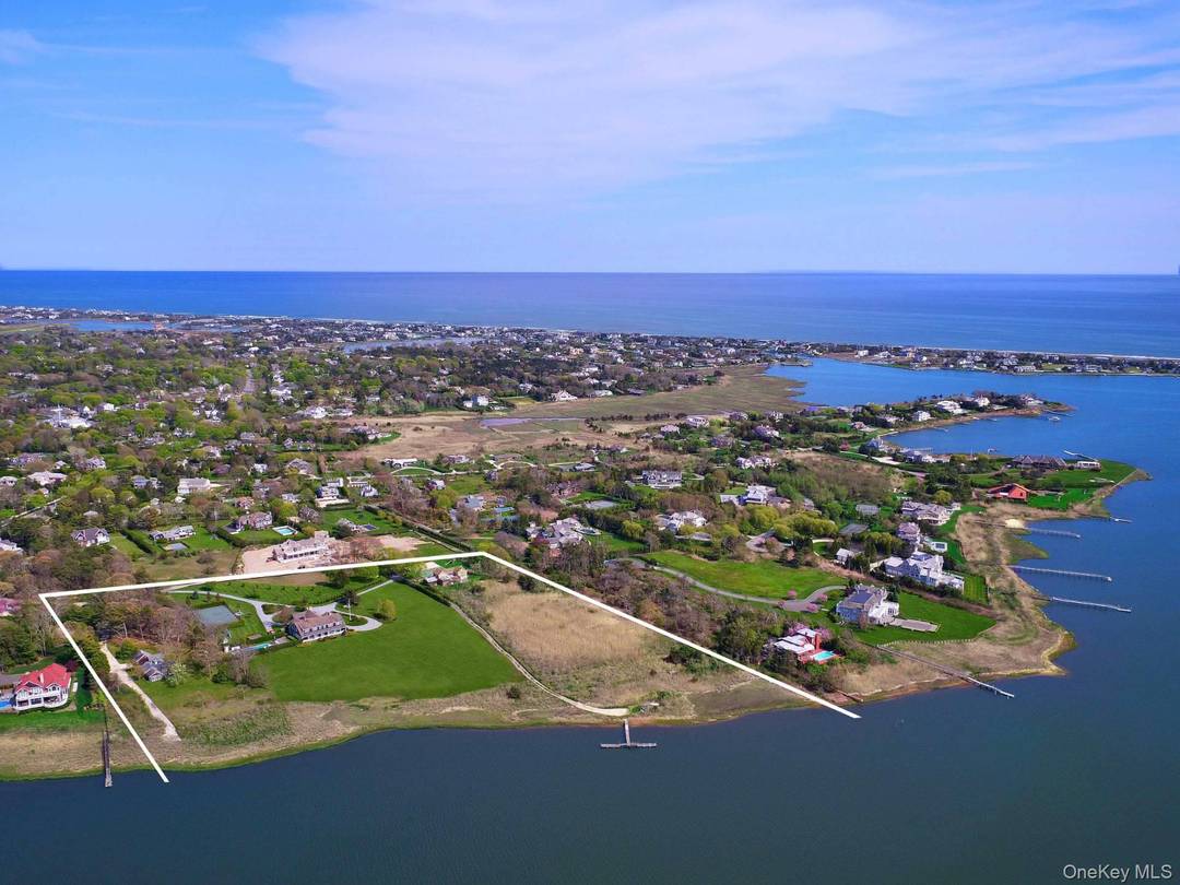 Welcome to a palatial bay front estate at 4 Sandacres Road, Quogue, NY, where elegance meets casual luxury.