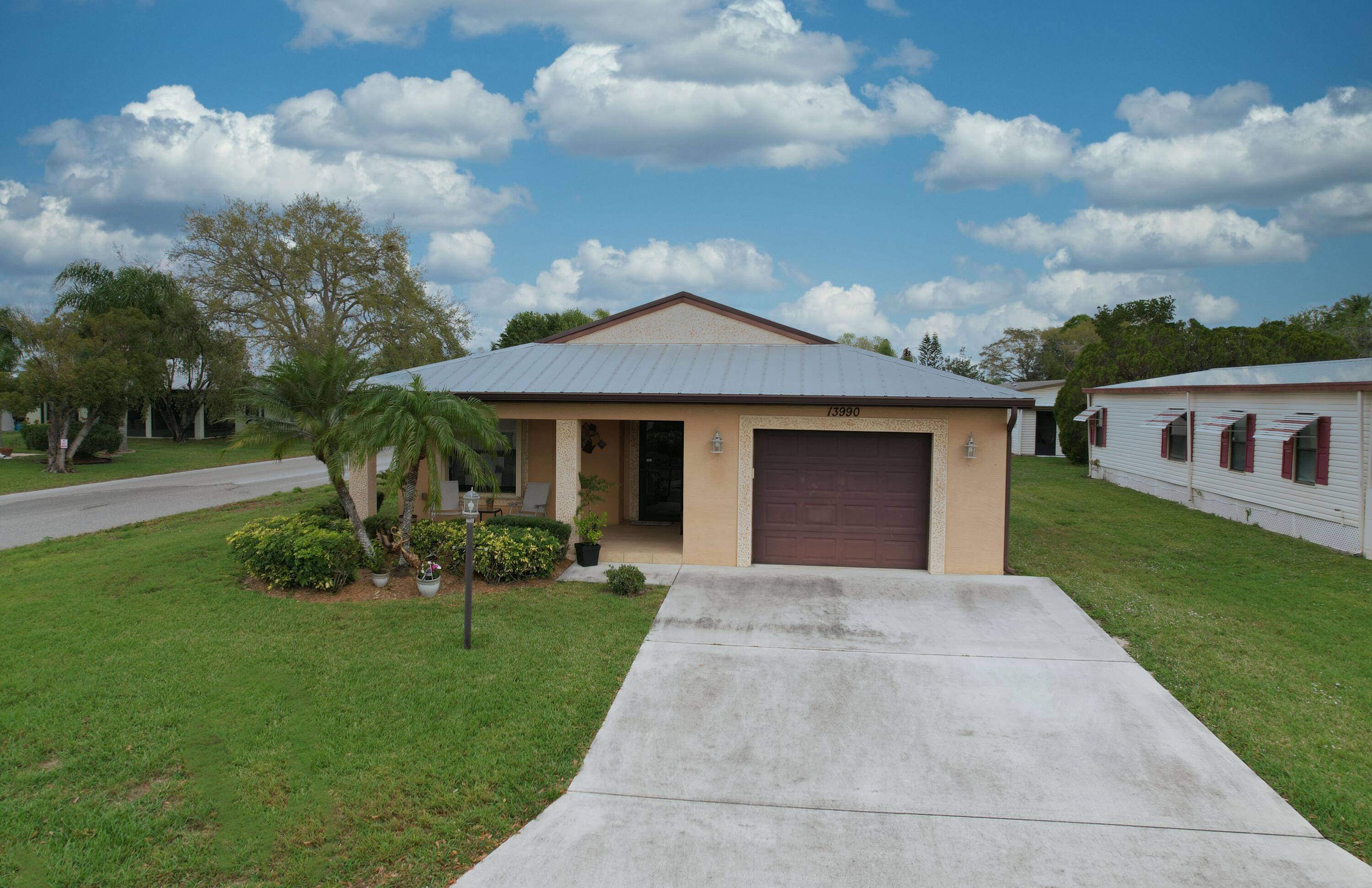 Enjoy the Florida lifestyle in this gorgeous 2 bedroom, 2 bath CBS home is nestled in the desirable 55 community of Spanish Lakes Fairways.