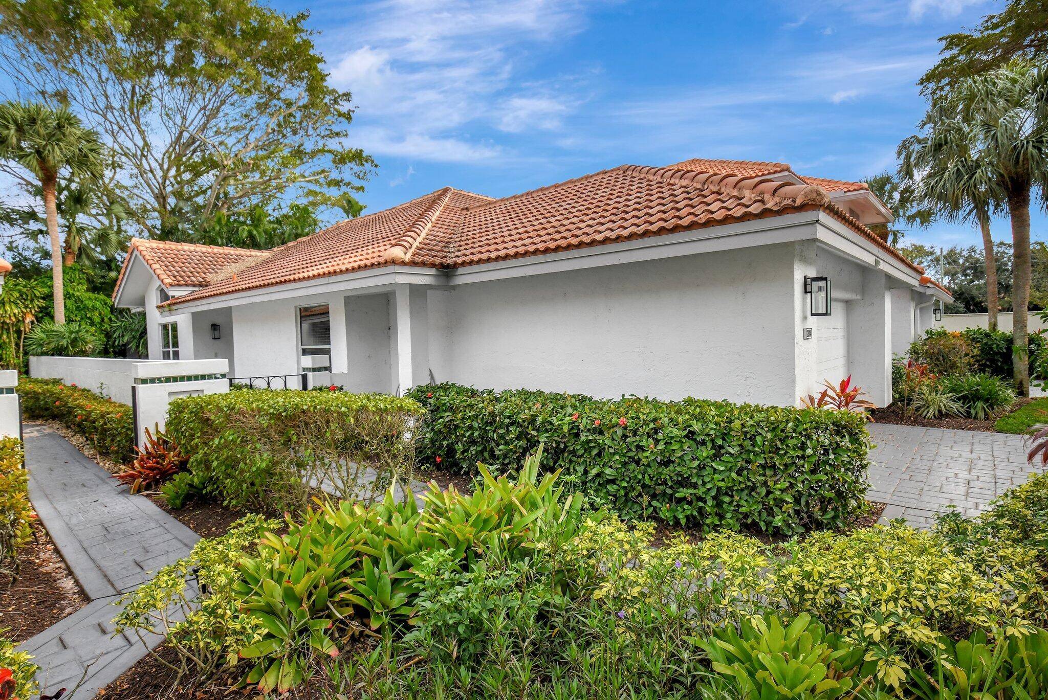 Nestled in the heart of the prestigious Broken Sound Country Club, this beautifully maintained 2 bedroom, 2.